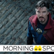 Doctor Strange looks up at something off screen, concerned.